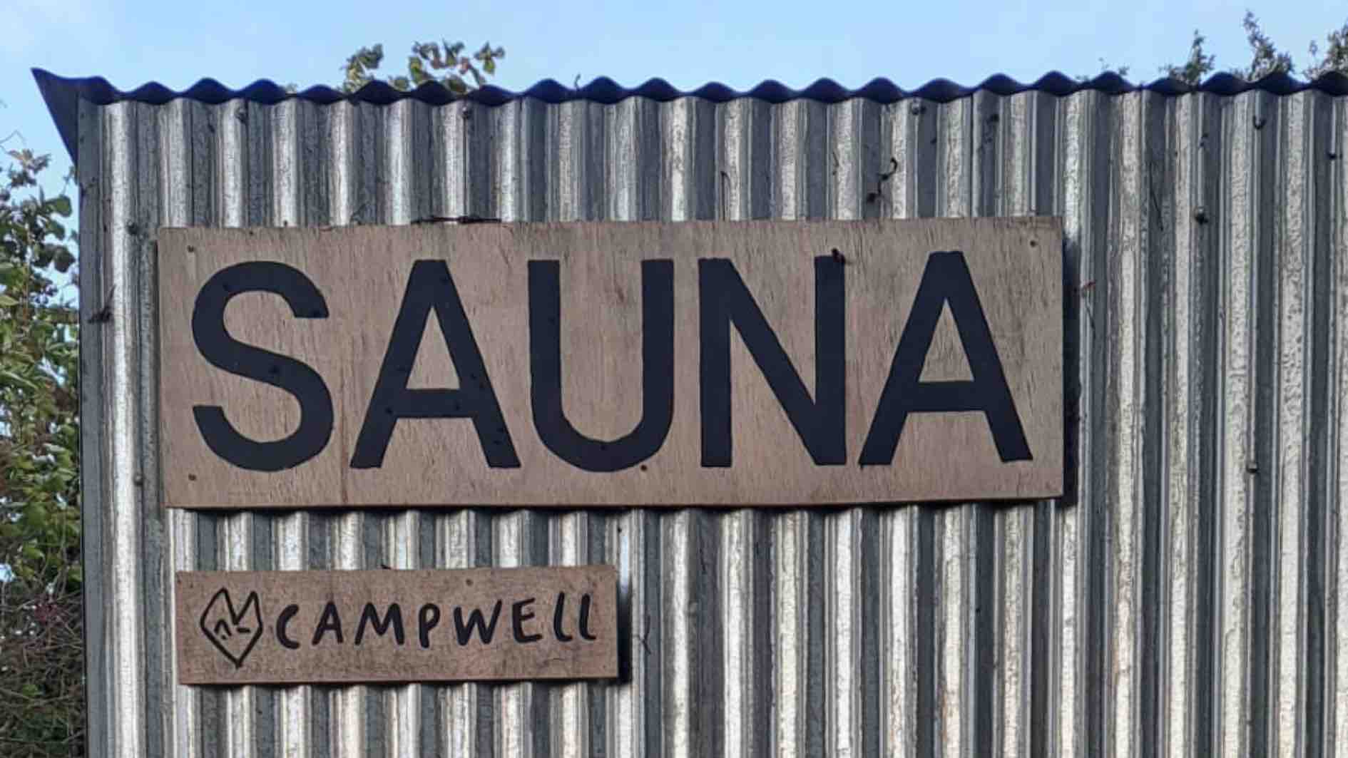 Campwell Farm sauna sign surrounded by nature